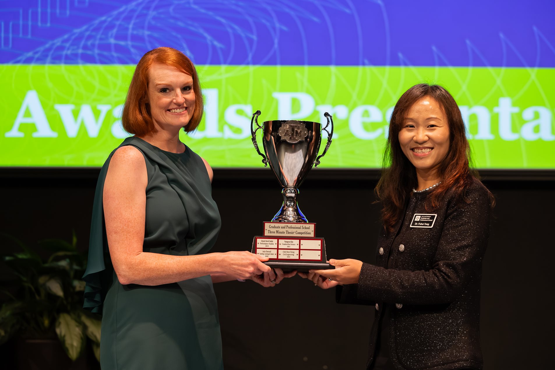 Photo of 2024 3MT winner Andrea Porter with Dean Tong